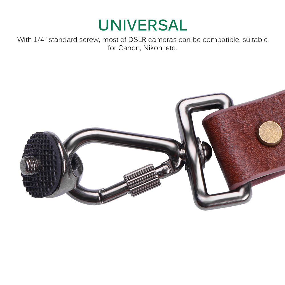 Camera strap with metal clasp and leather section on a white background