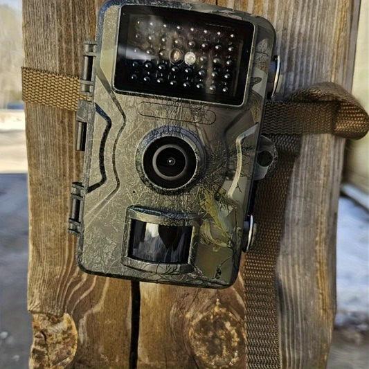 Camouflage trail camera attached to a wooden post