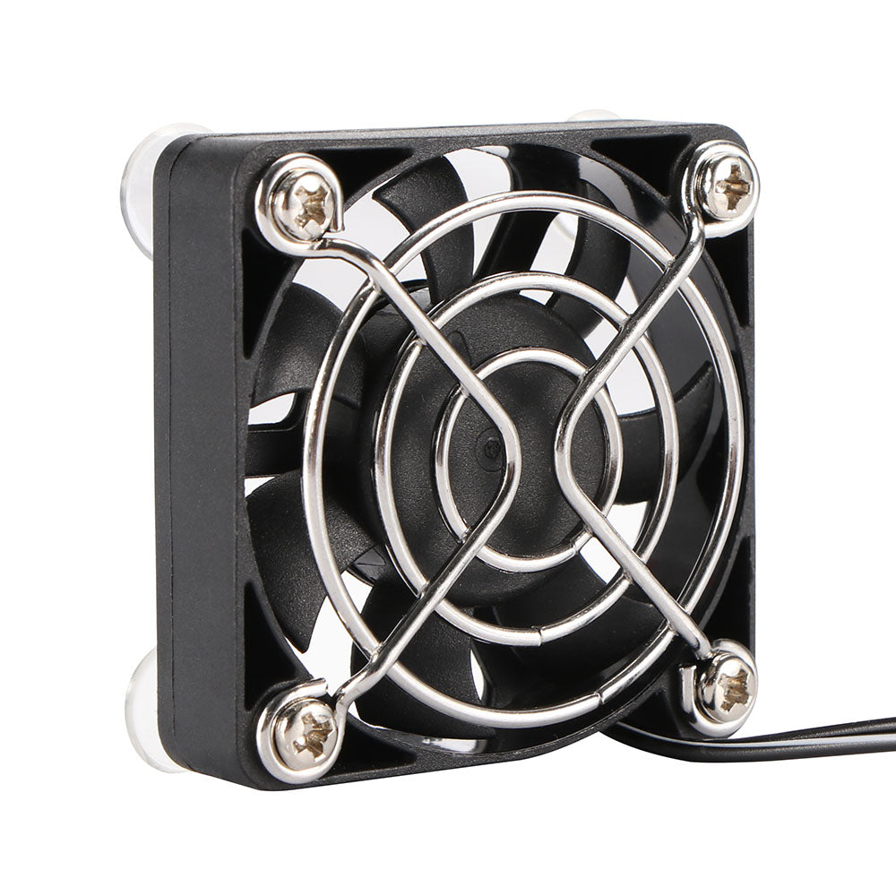Small black cooling fan with metallic blades on a white background. Best electronics online store near me. Axis-Dynamics