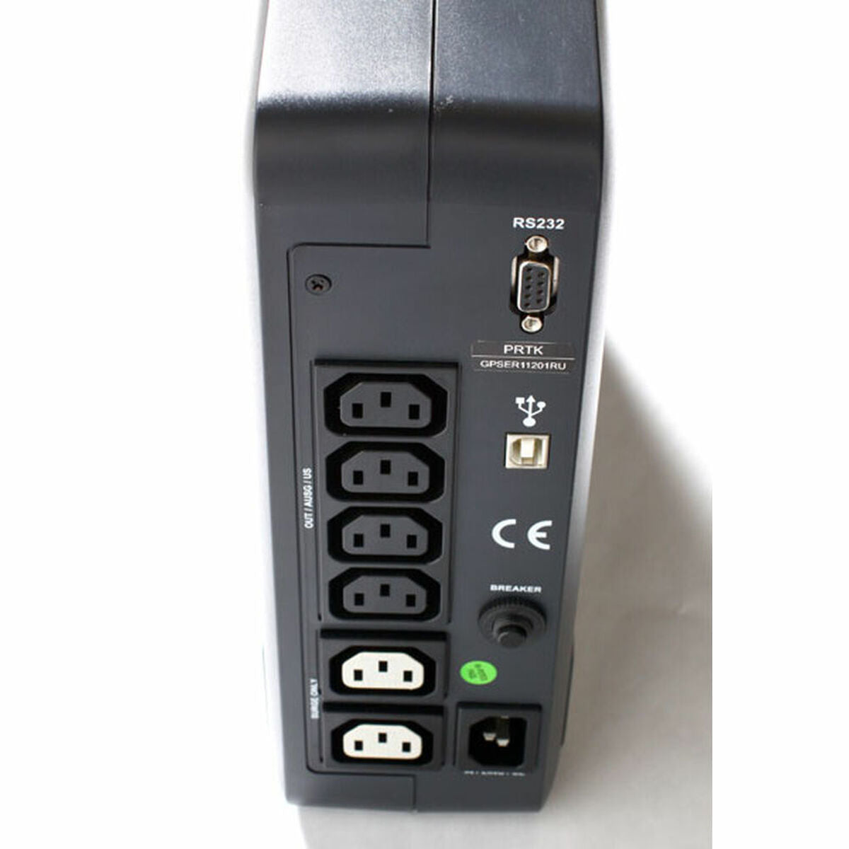 Back view of a power strip with multiple outlets and connectors on a white background