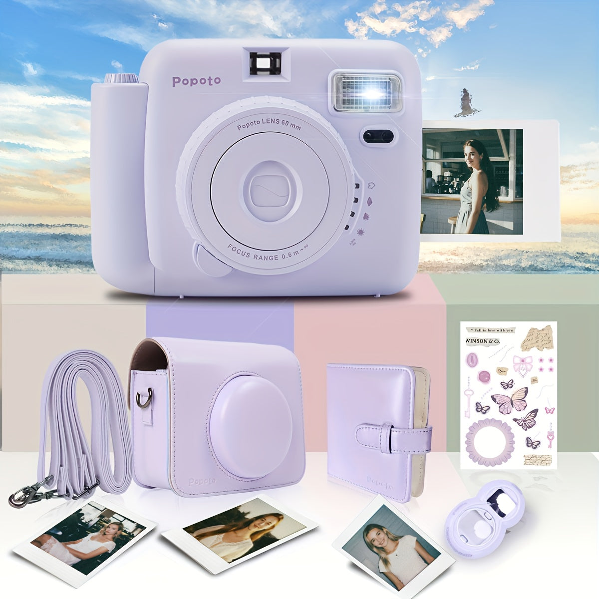 Purple instant camera with accessories on a table with a scenic background