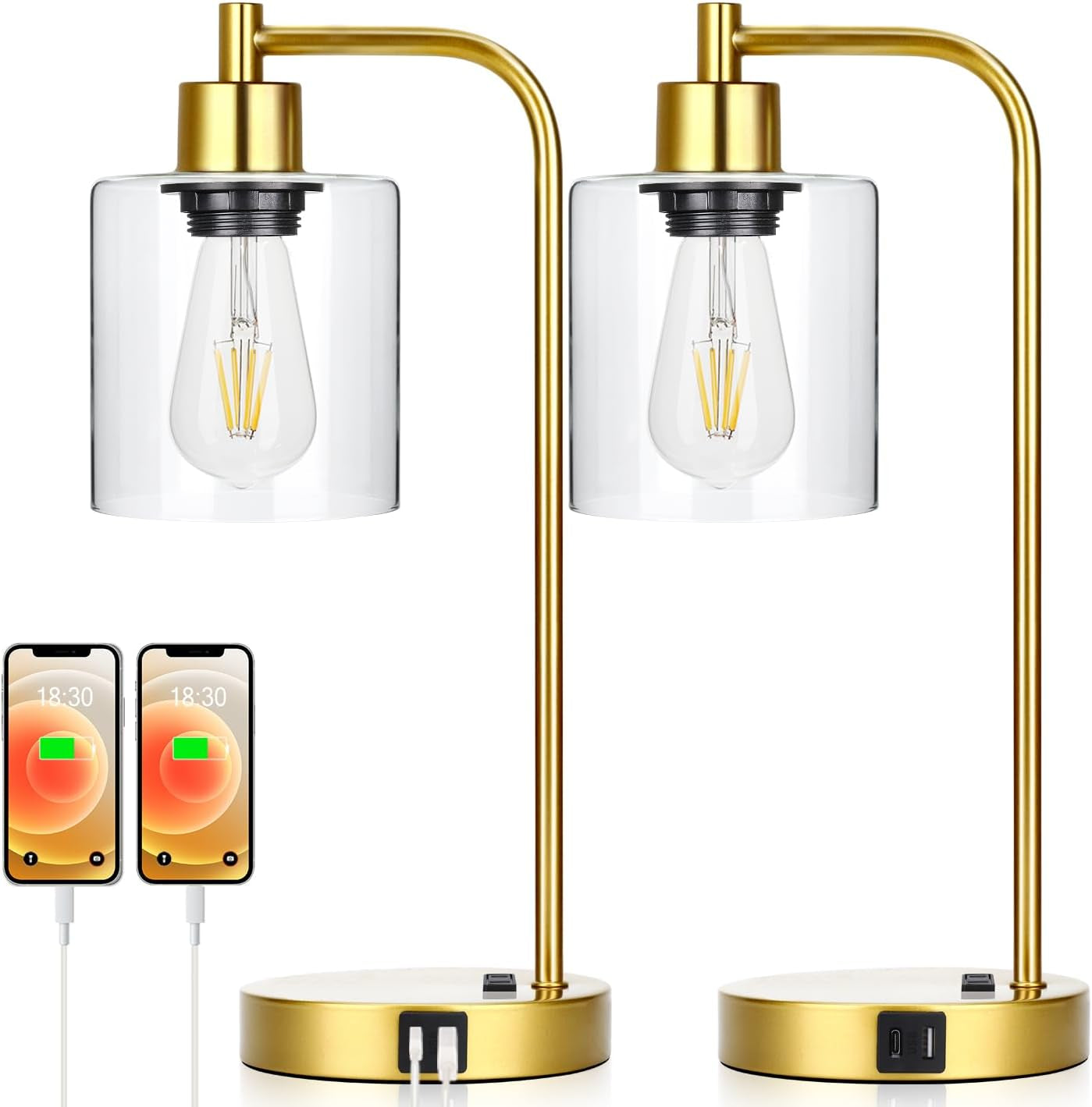 Pair of gold table lamps with clear glass shades on a white background