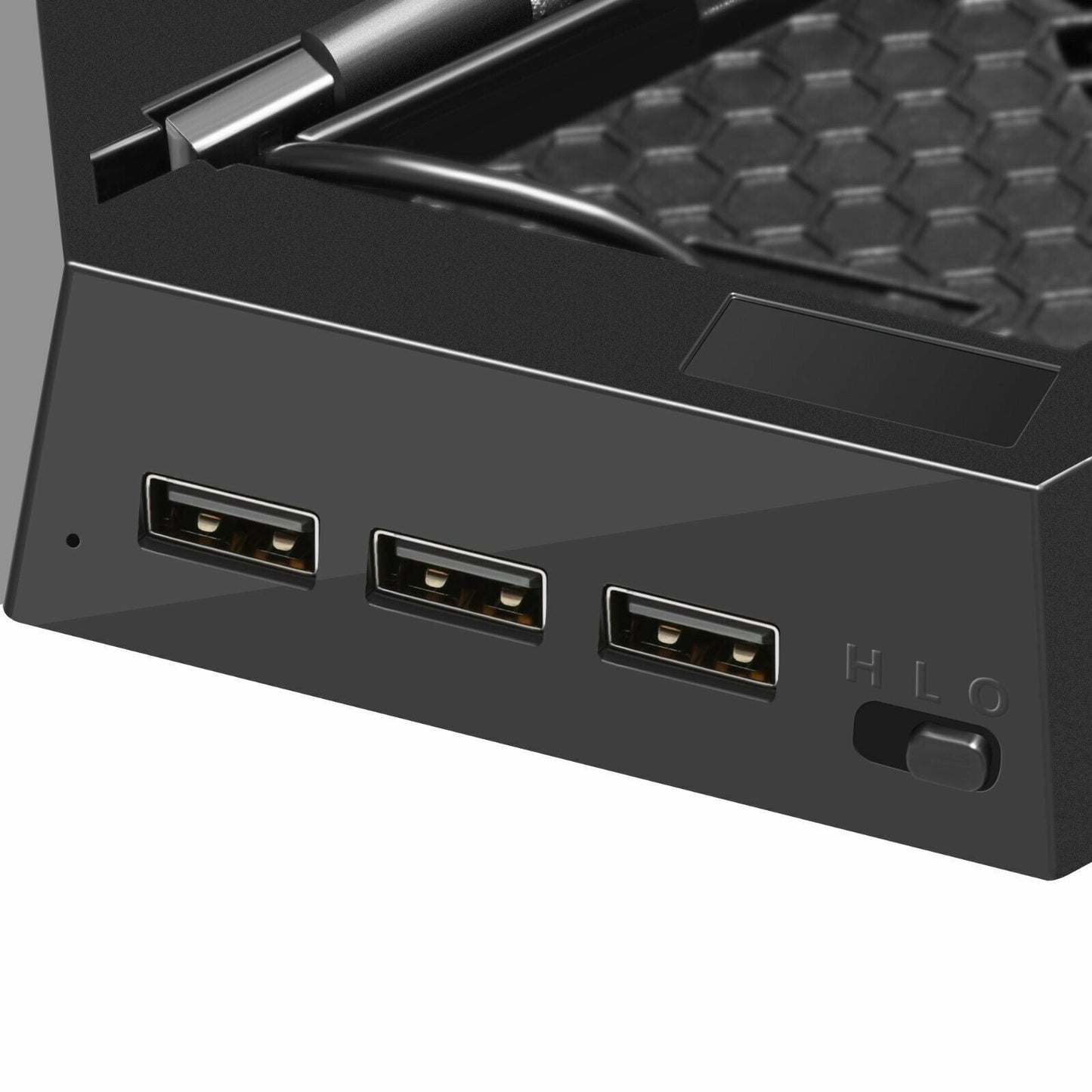 Close-up of a black electronic device with multiple ports on a white background