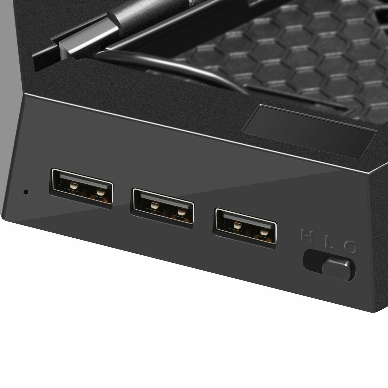 Close-up of a black electronic device with multiple ports on a white background
