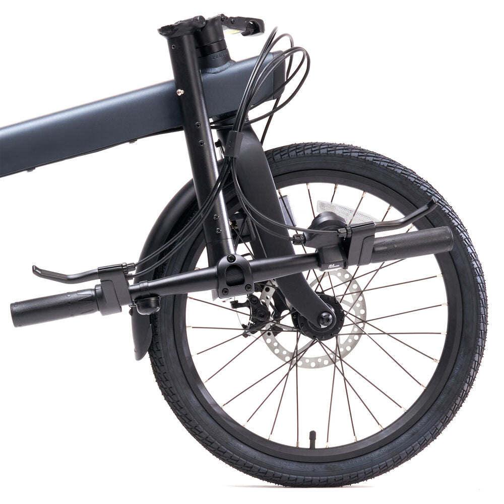 Close-up of a folded bicycle on a white background