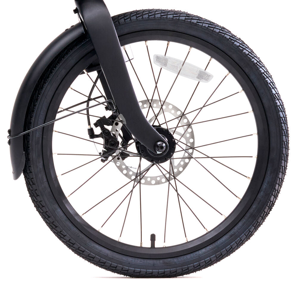 Close-up of a bicycle wheel with disc brake on a white background