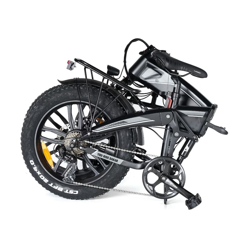 Black folding bike with large front wheel on a white background