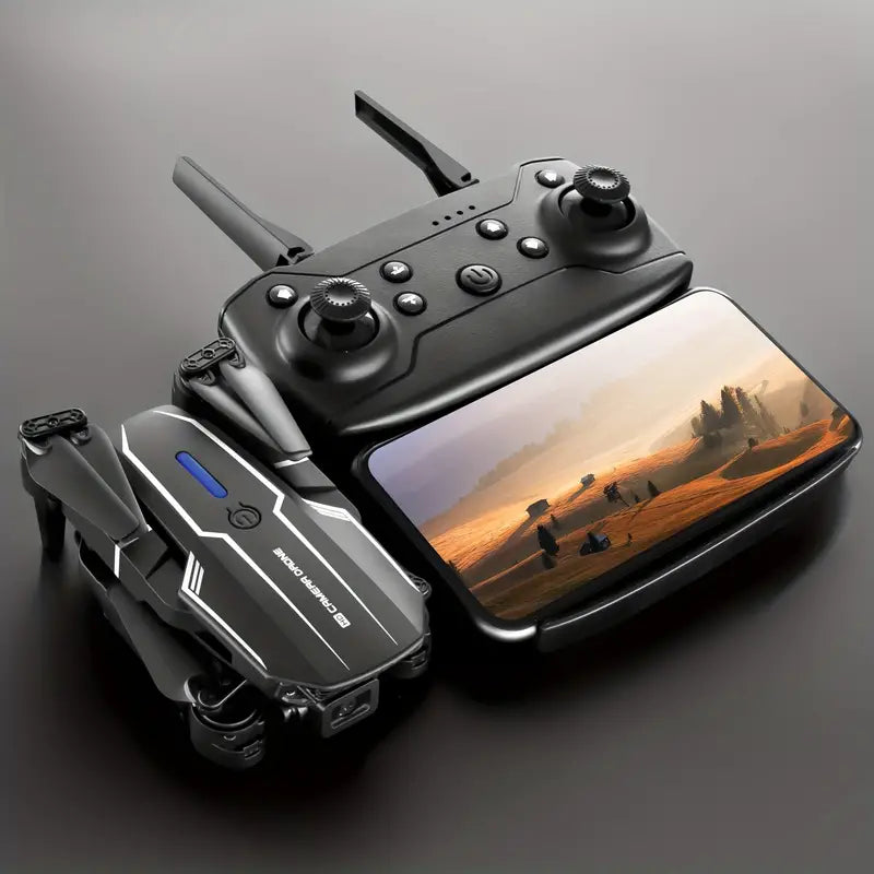 Drone controller and smartphone displaying a desert scene on a gray background