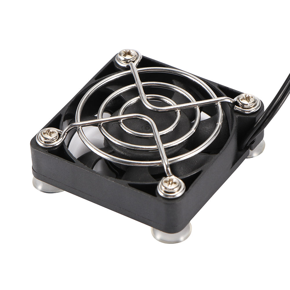 Small black cooling fan with metallic blades on a white background. Best electronics online store near me. Axis-Dynamics