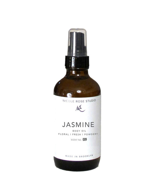 Brown spray bottle labeled 'Jasmine' from Nicole Rose Studio on a white background. Best online retail store. Axis-Dynamics