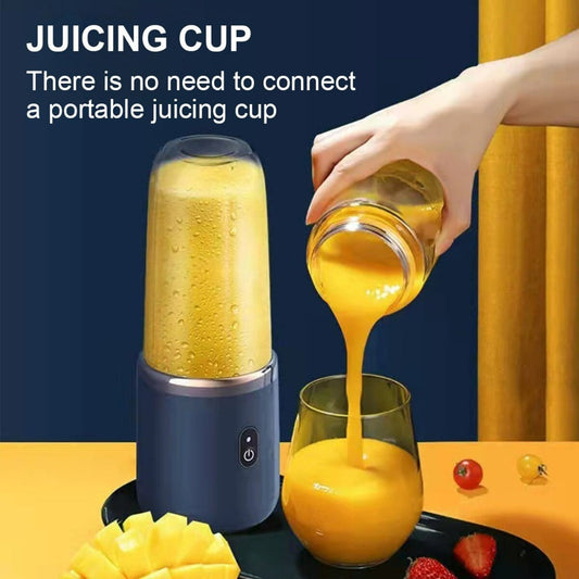 Portable juicer with a juicing cup being used to pour juice into a glass.