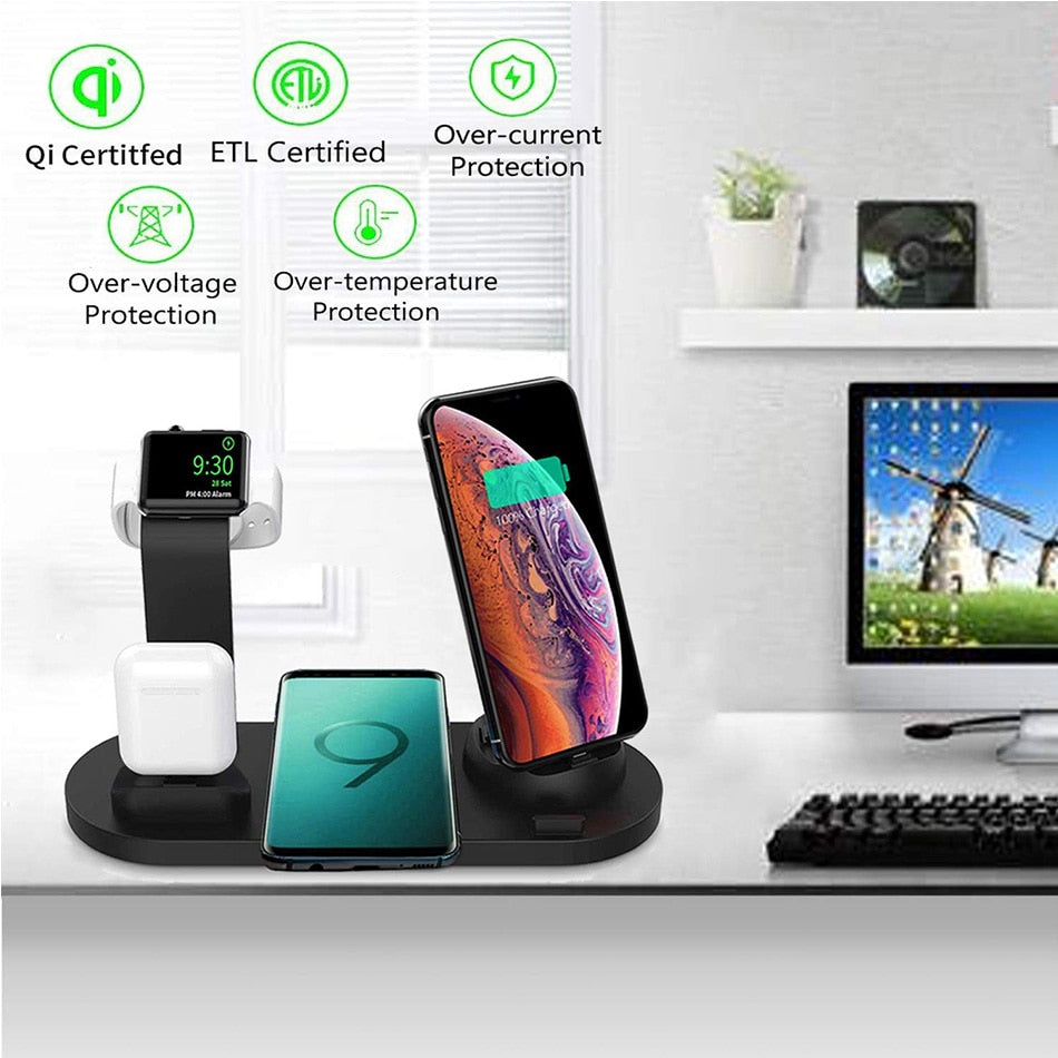 Multi-device wireless charging station on a desk with electronic devices.