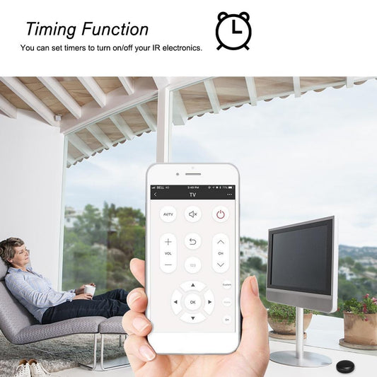 Hand holding a smartphone with remote control app on screen, in a room with a TV and person sitting on a couch.