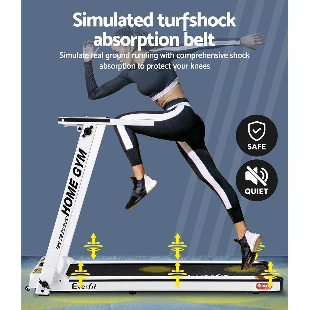 Treadmill with simulated turf shock absorption belt, showing a person using it.