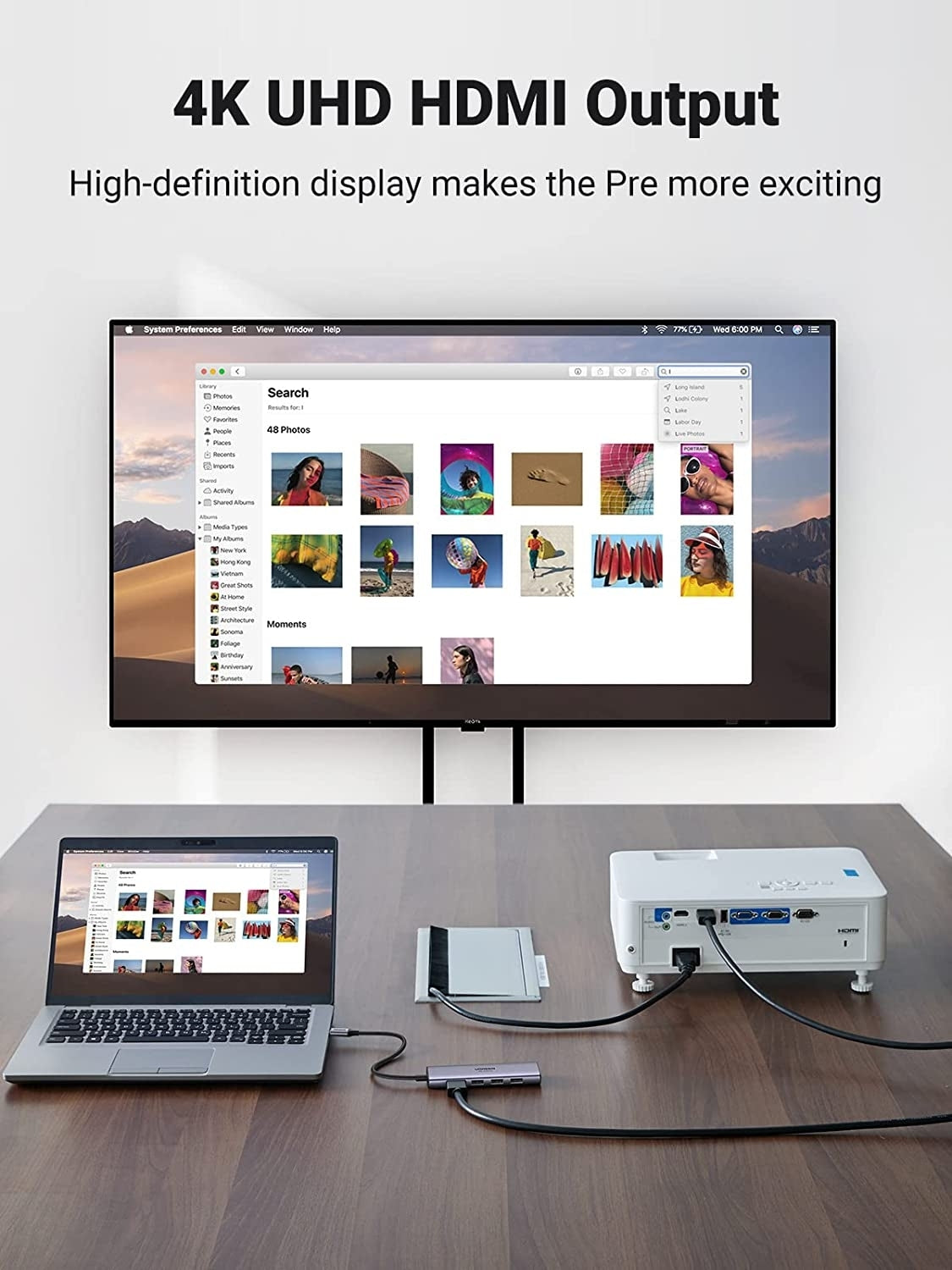 4K UHD HDMI Output setup with laptop, monitor, and projector on a wooden surface.