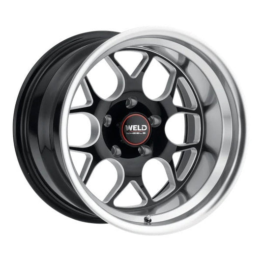 Car wheel rim with black and chrome finish on a white background