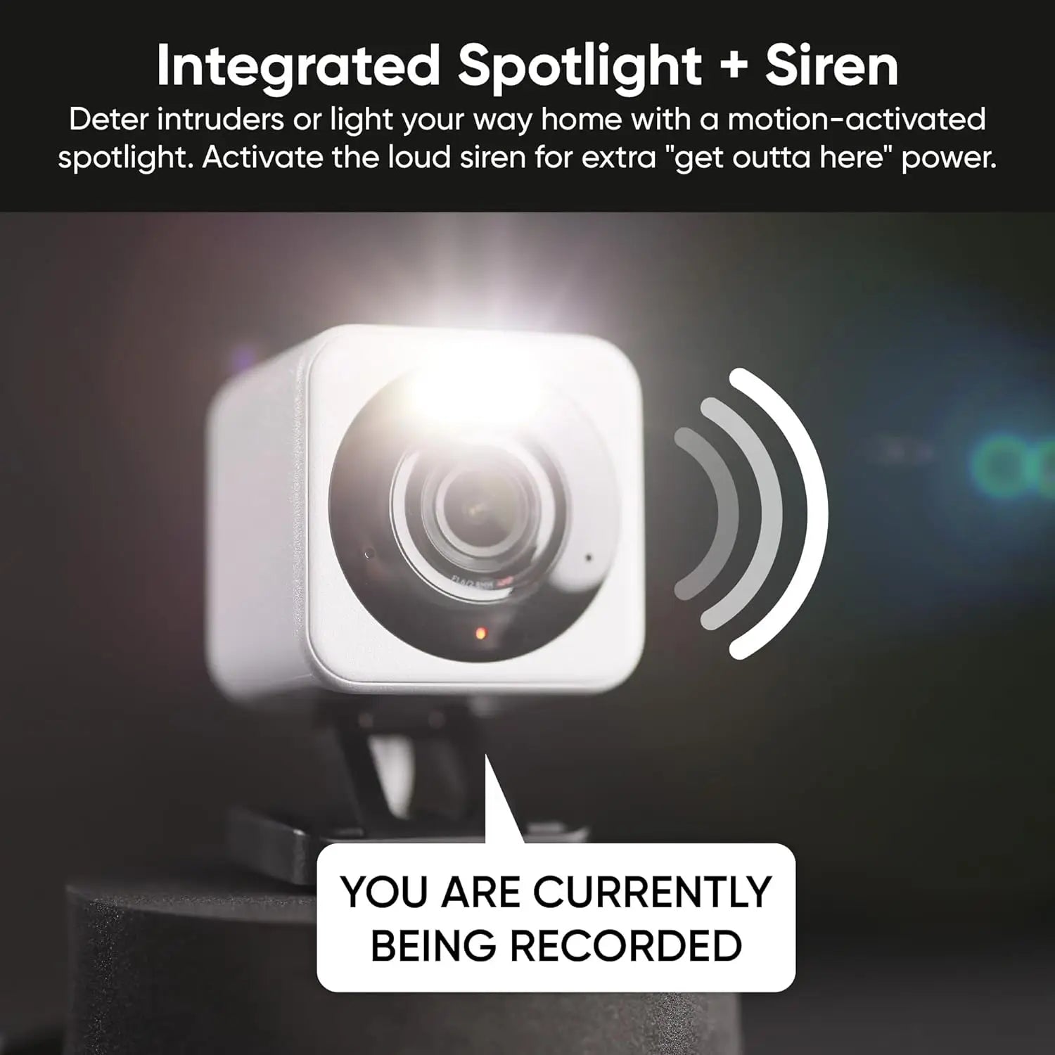 Security camera with spotlight and siren feature on a dark background
