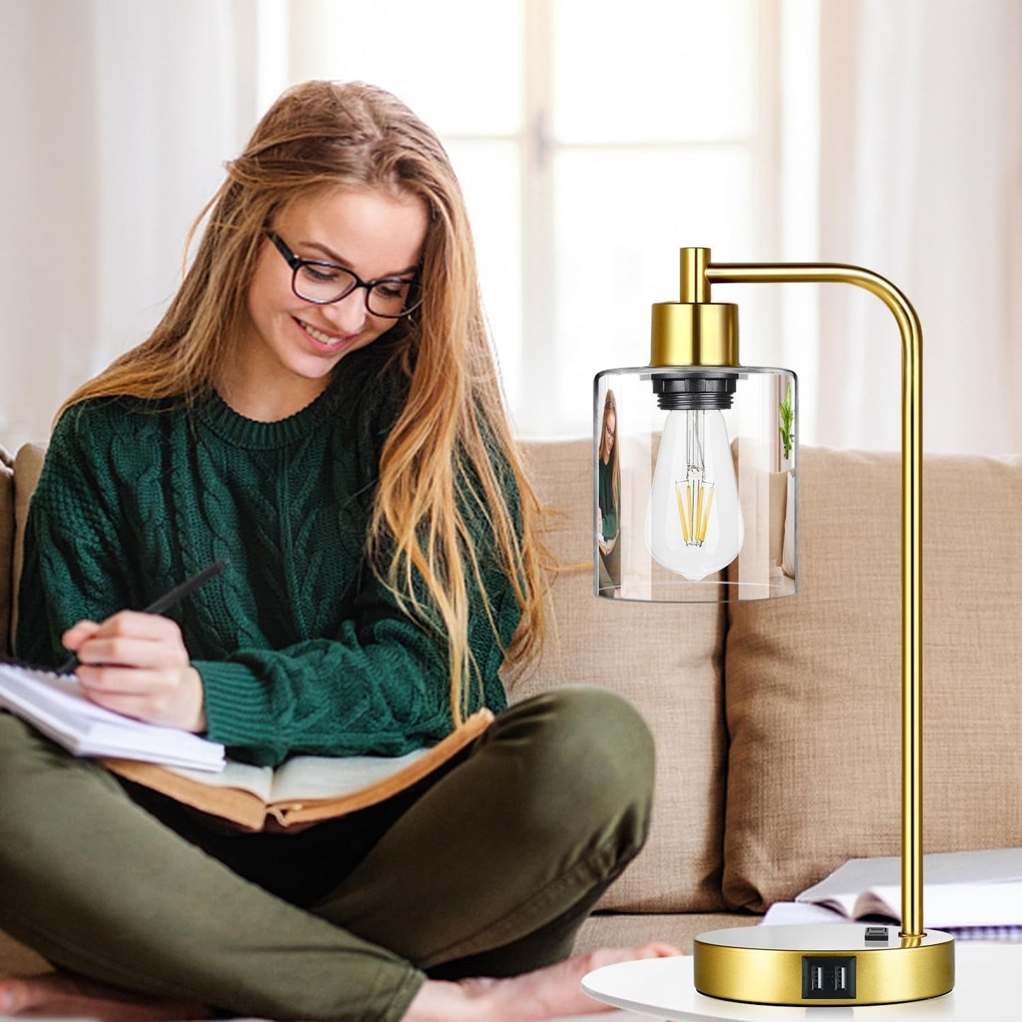 Woman sitting on a couch with a gold lamp next to her