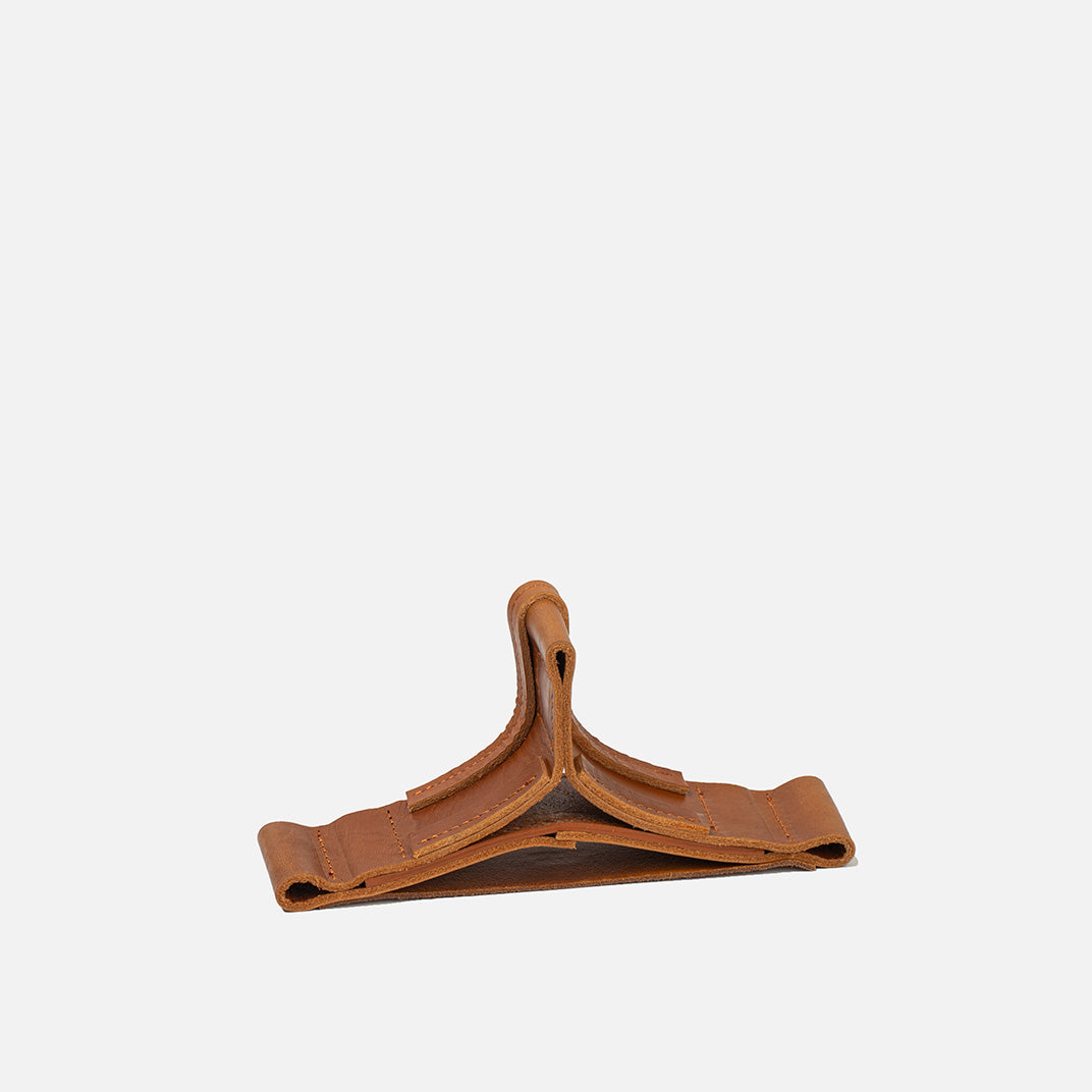 Brown leather hanger on a white background