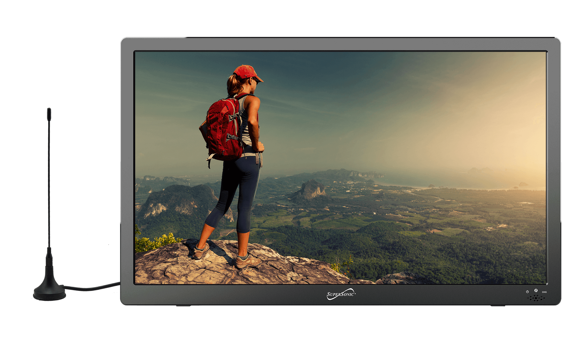 Monitor displaying a scenic view of a person with a red backpack standing on a mountain peak.