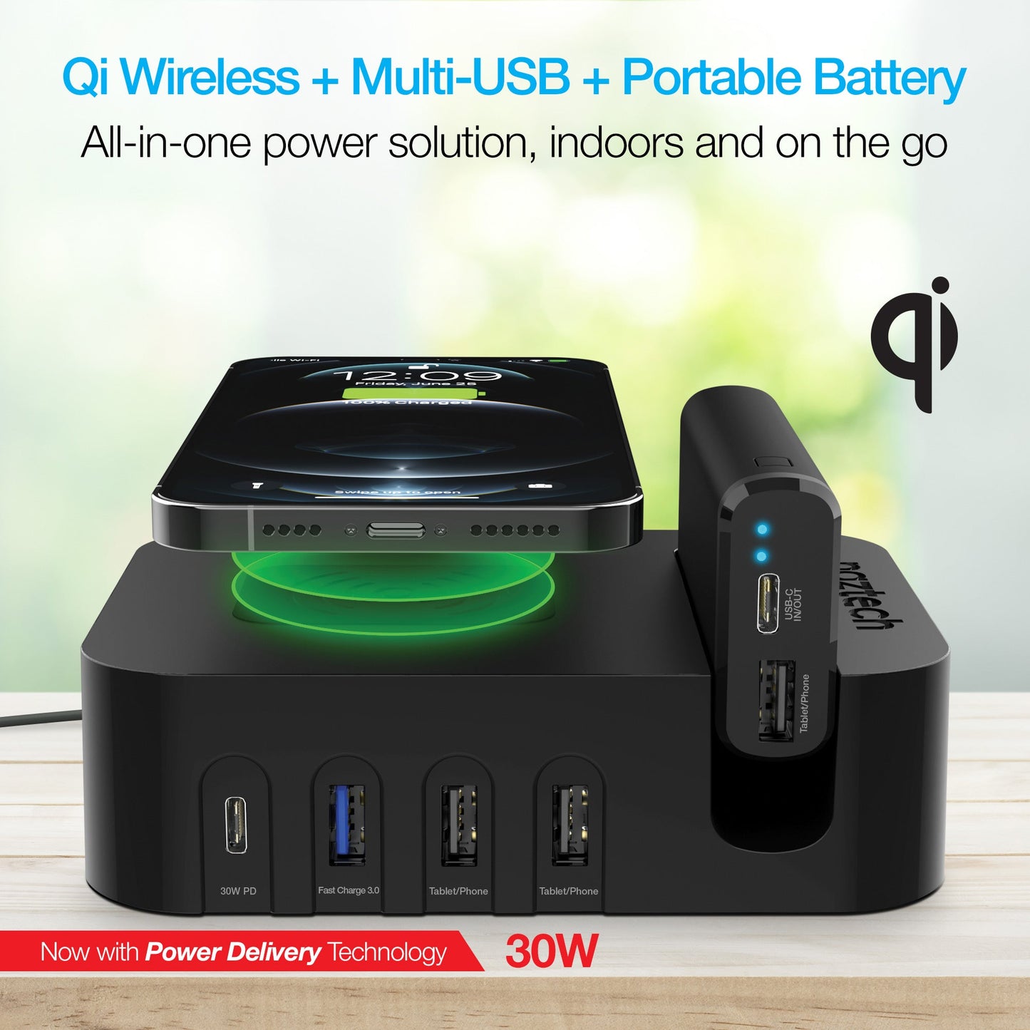 Qi wireless charging pad with multi-USB ports and portable battery on a blurred background
