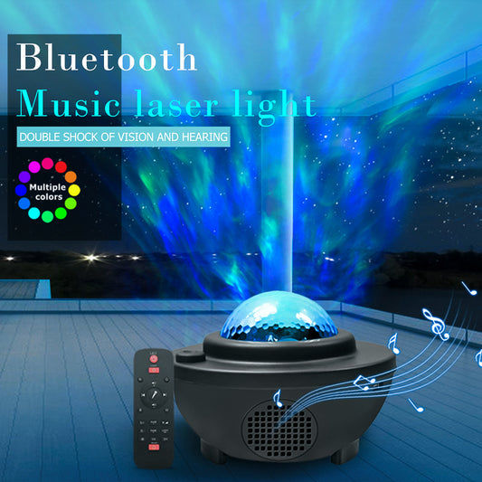 Bluetooth music laser light projector with remote control on a wooden floor.