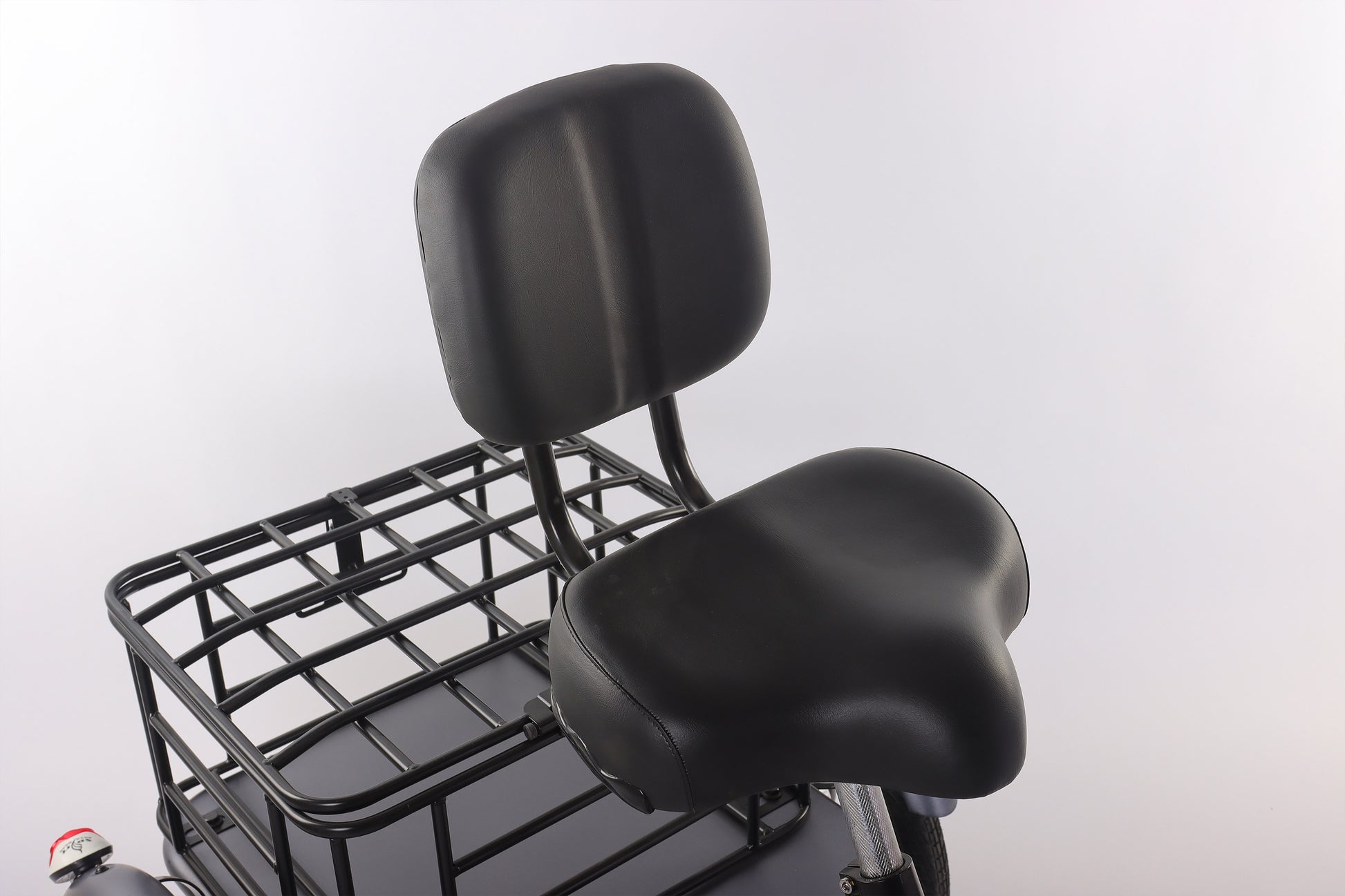 Black motorcycle seat with backrest and basket on a white background