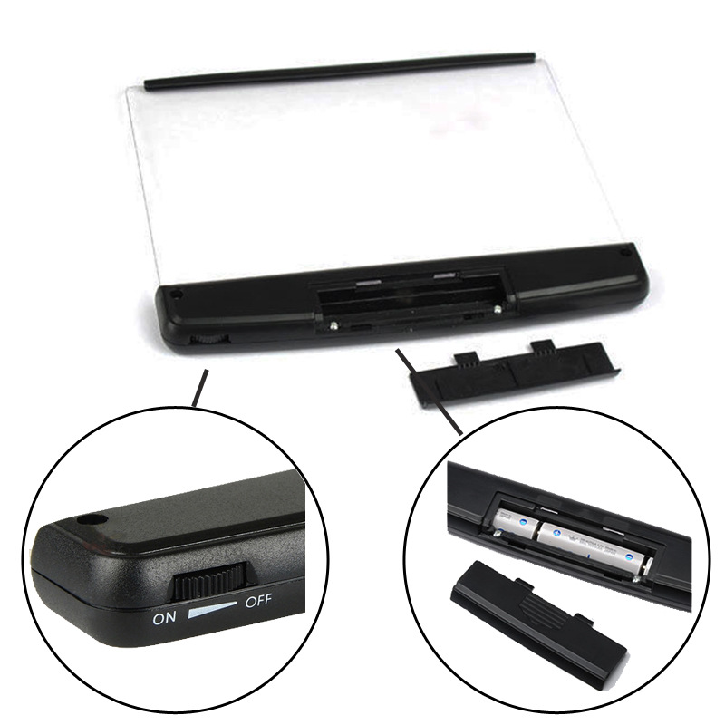 Black electronic device with various components on a white background