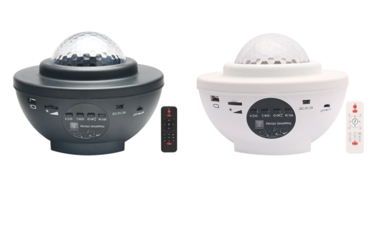 Two star light projectors with remote controls on a white background