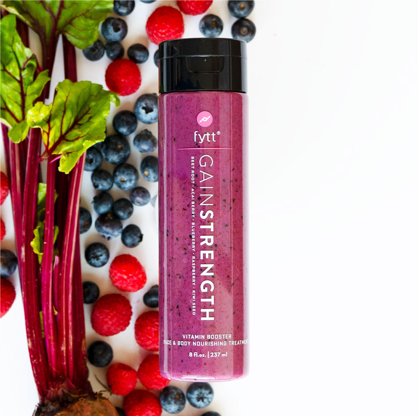 Fyttnutrition Gain Strength supplement bottle surrounded by berries and rhubarb on a white background. Best online retail store. Axis-Dynamics