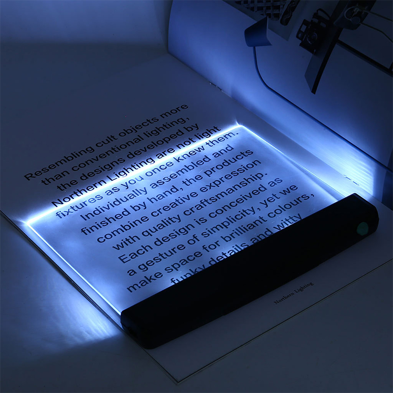 Light-up book with text on a dark background