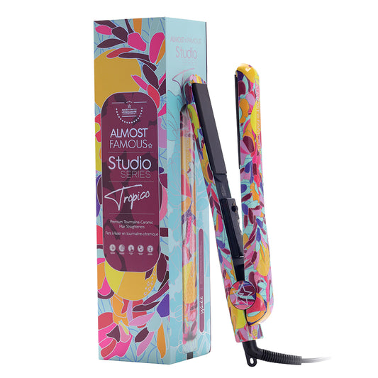 A hair straightener from the Almost Famous Studio Series Tropico model, shown next to its colorful retail packaging box on a plain white background. Buy skincare online. Axis-Dynamics