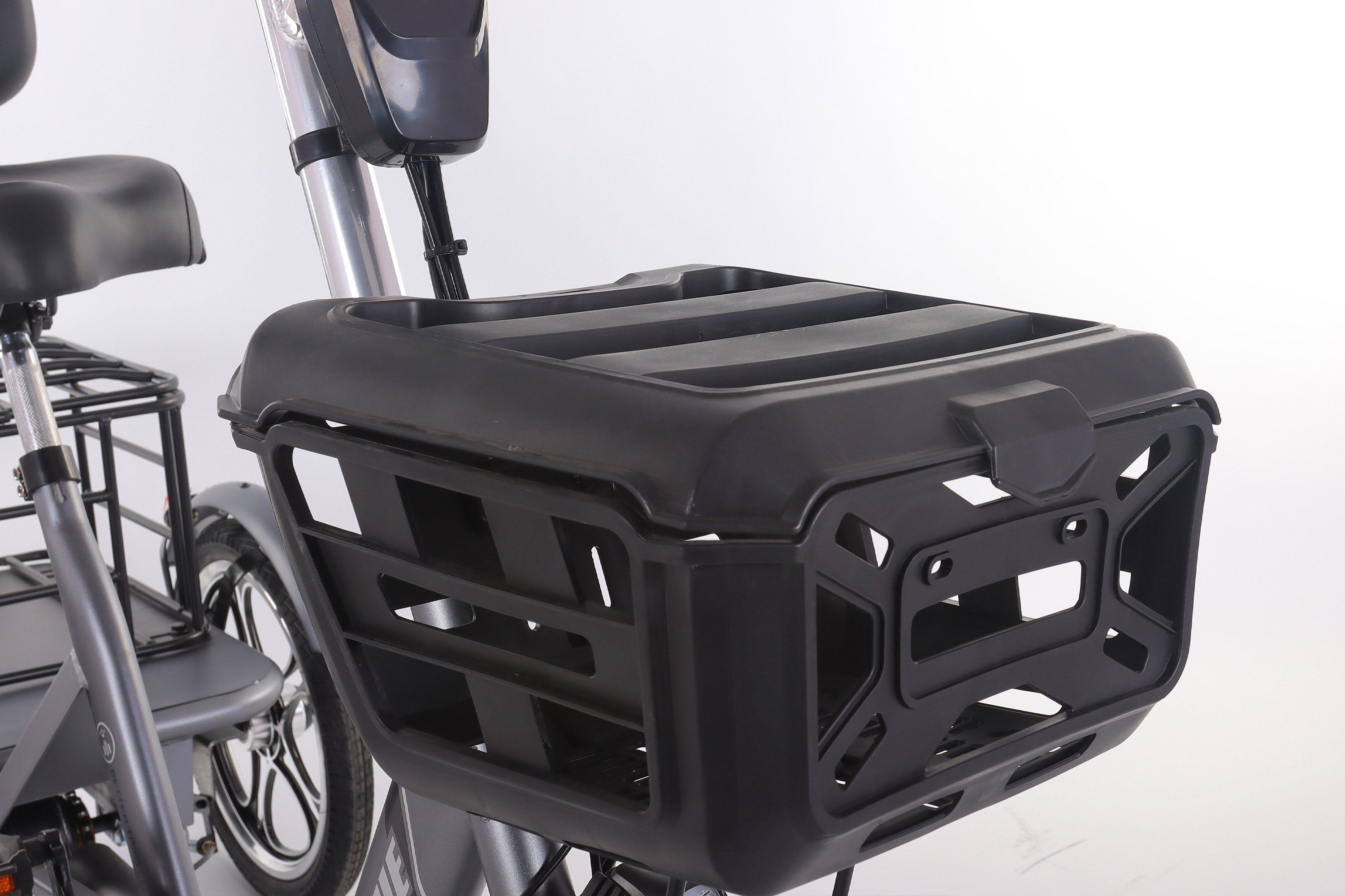 Black bike cargo box attached to a bicycle on a white background