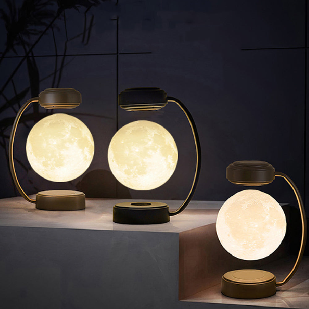 Moon-shaped table lamps on a dark background