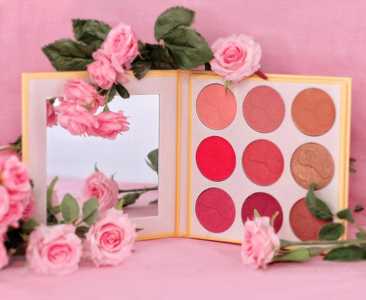 Makeup palette with pink flowers on a pink background. Best online retail store. Axis-Dynamics
