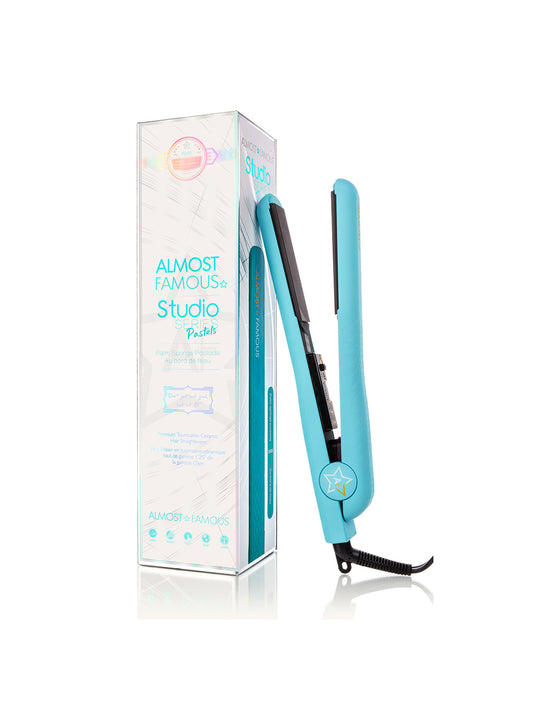 Blue hair straightener with packaging on a white background