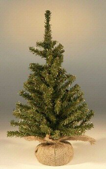 Small artificial Christmas tree on a neutral background