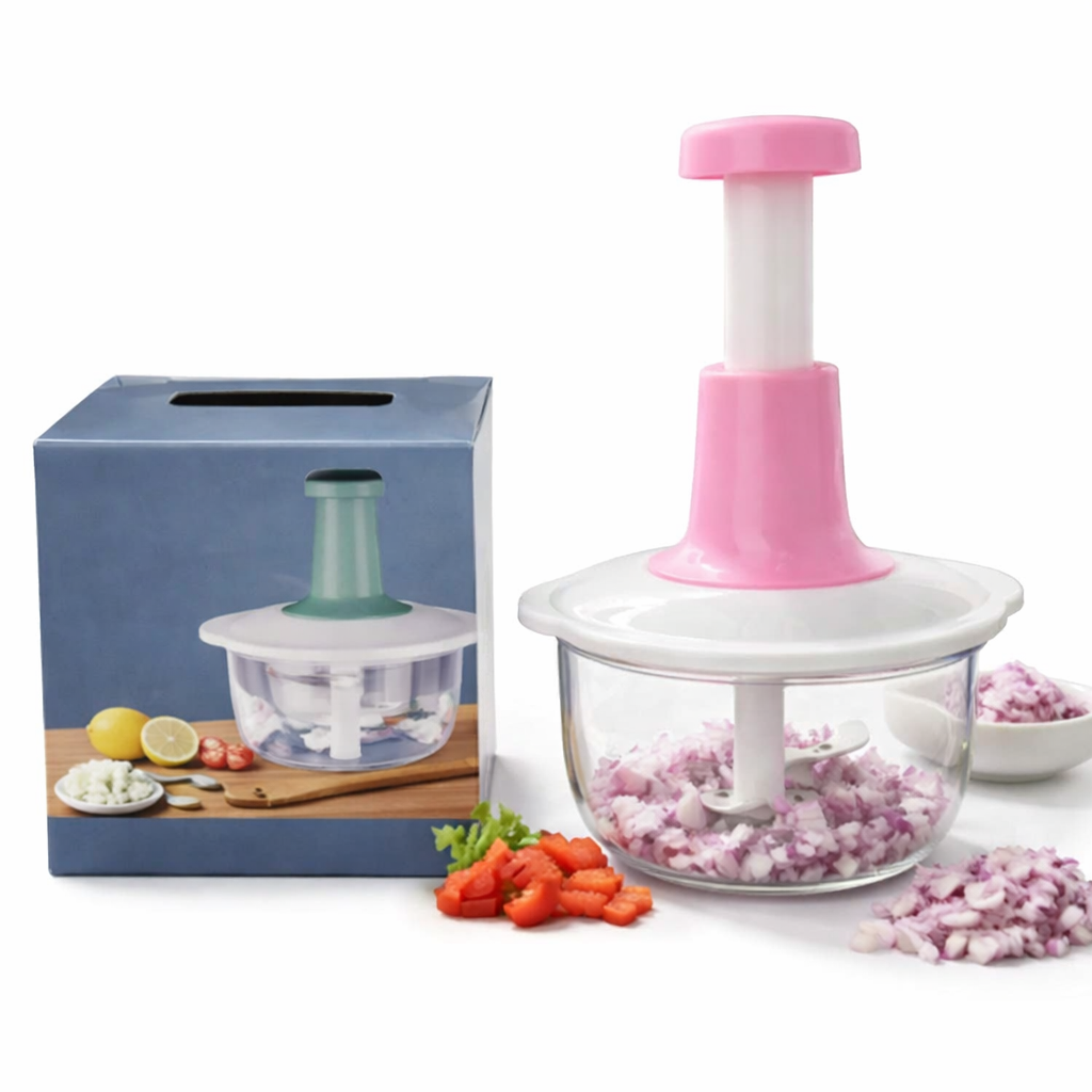 Pink and white kitchen chopper with chopped vegetables on a white background