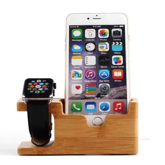Wooden charging stand with smartphone and smartwatch on a white background