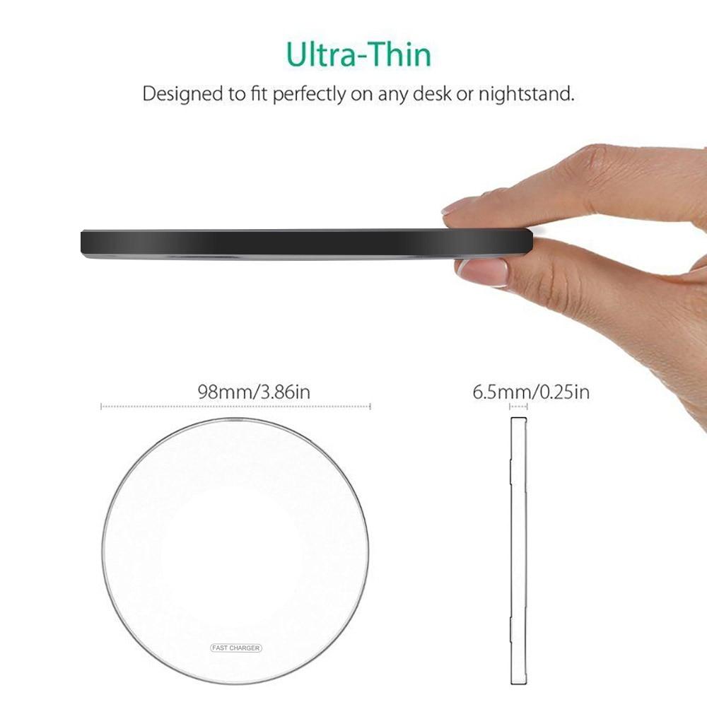Ultra-thin black object held by a hand with measurements displayed.