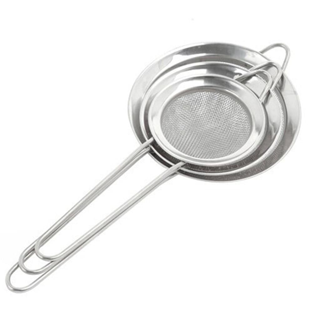 Stainless steel mesh strainer with handle on a white background
