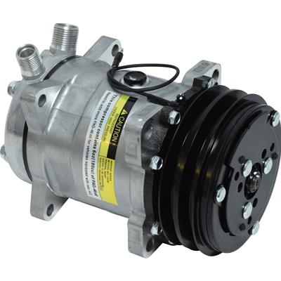 A silver aluminum automotive air conditioning compressor pulley assembly with a black pulley and belt cover, featuring a yellow warning label on the side. Best automotive parts and accessory online shop. Axis-Dynamics.