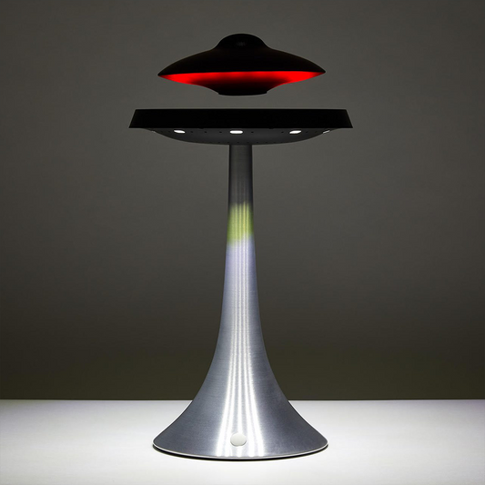 Futuristic UFO-shaped lamp with red light on a dark background